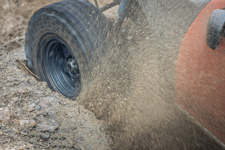4WD car Off-road wheel spinning, 4WD off road motion the wheel tires and off-road that goes in the mud, 4WD spinning wheel tire in mud terrain.の写真素材