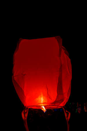 sky lantern, also known as Kongming lantern or Chinese lantern in black skyの写真素材