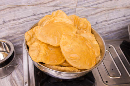 popular Indian fast food puri made of corn flour fried with vegetable oilの写真素材