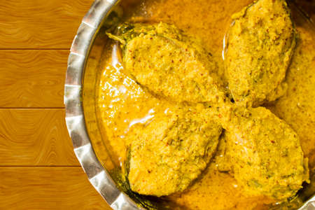 popular Bengali Illish/Hilsa fish curry with grinned mustard seed.の写真素材