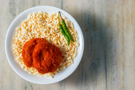selective focus of Aloo Chop, an Indian snack made of gram flour and potatoes.