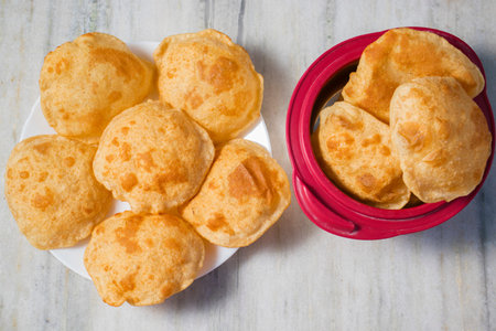 famous Indian oil fried food puri is ready to serve.