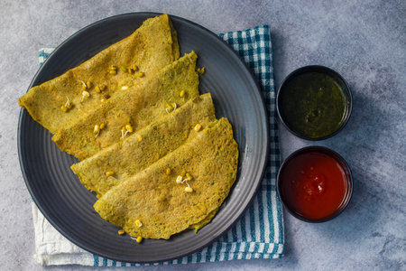Indian food Moong Dal Chilla is ready to eat.