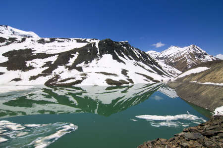 chandratal in summer, half frozen lake between leh and manaliの写真素材