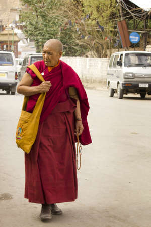 Ladakh, Jammu and Kashmir, India July 20 2011:An Old monk walking in streets of Leh , Ladakh, Jammu & Kashmir, Indiaのeditorial素材