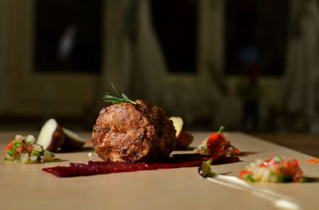 Grilled pork with papines and garlic on a stone tray.の写真素材