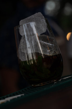 A sweet cocktail with lots of ice on a draining tray.の写真素材