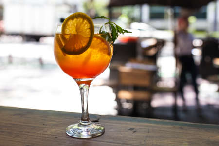 sweet drink with orange and mint slicesの写真素材