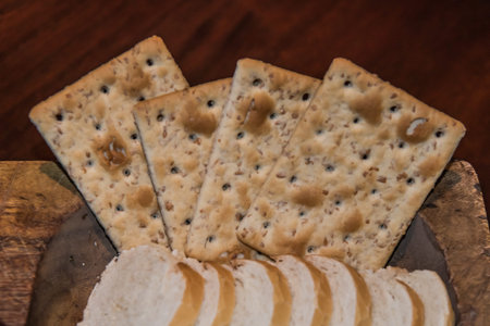 biscuits and bread on a wooden boardの写真素材