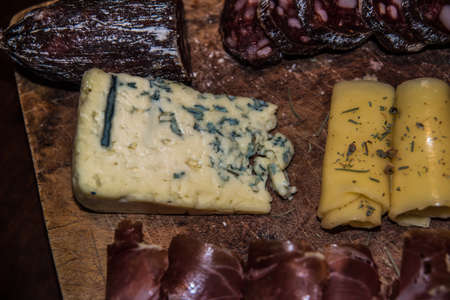 Argentine chopped with different cold cuts and olives on wooden boardの写真素材