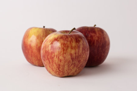 fresh red apples on a white tableの写真素材