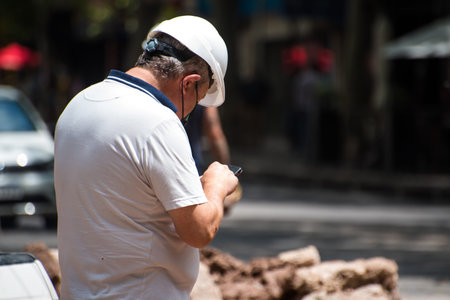 construction worker supervising repair works on a street