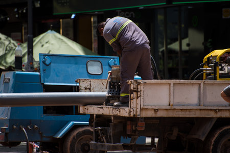 construction worker preparing machinery to start his job