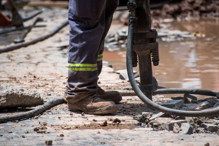 builder working with a jackhammerの写真素材