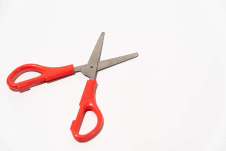 red open paper scissors on white tableの写真素材