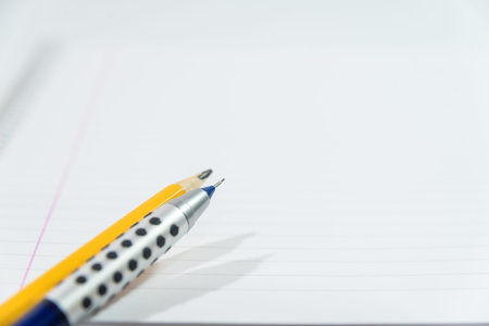 pencil and mechanical pencil on blank sheet of paperの写真素材