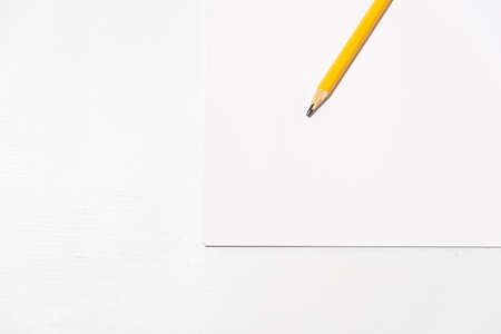pencil on blank sheet on white tableの写真素材