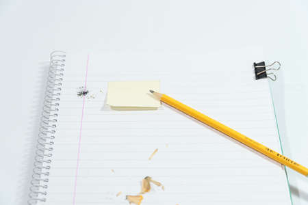 pencil, eraser and hook on blank sheetsの写真素材