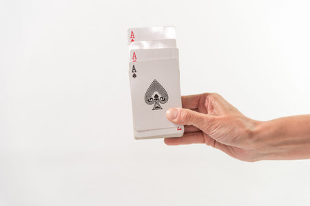 hand with shuffled cards, white background