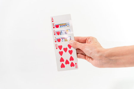hand with open red cards in fan