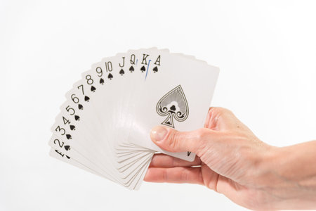 hand with black decks of fan card