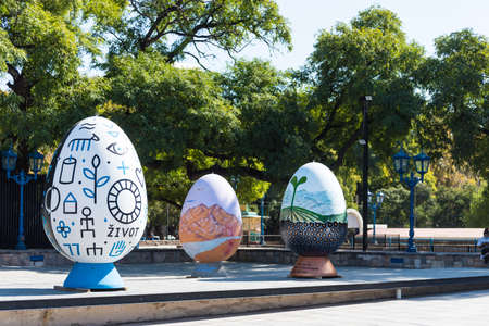 sculptures in the form of artistically painted eggs placed in a squareの写真素材