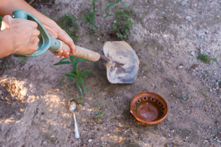 shovel and pot on dirt soilの写真素材