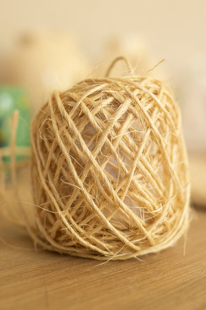roll of natural thread on a wooden tableの写真素材