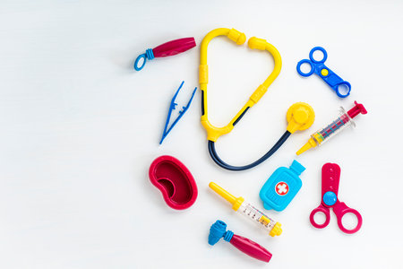 Childrens medical instruments. Childrens doctor concept. Pediatrics. Toy medical devices on a white background. Kids playing professional doctor. Get vaccinated Conceptの写真素材