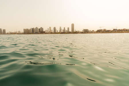 Tel Aviv skyline. A view from the water of the old Yaffa Portの写真素材