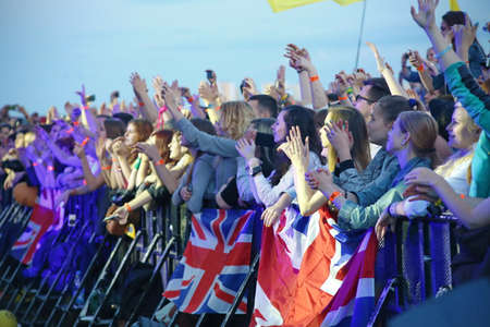 MINSK, BELARUS - JULY 03: People crowd with british flags during 'Most festival' on July 3, 2014 in Milnsk, Belarus.のeditorial素材