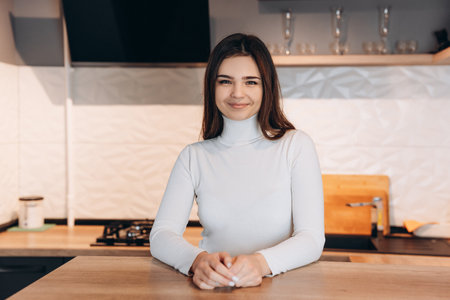 Cute young girl is smiling and looks happy. Freelancer female. Student girlの写真素材