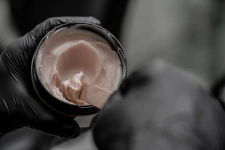 Close-up photo of tattoo cream healing in salon. Concept of tattoo artist salon workshop.の写真素材