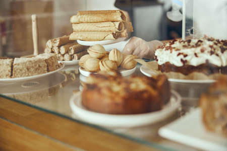 Delicious sweets. Bakery and restaurant deserts. Sweet food, buffet. Unhealthy food. Pieces of cakeの写真素材