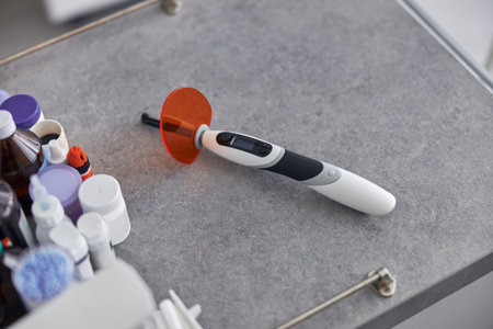 Dental instruments close up. Dental curing light, treatment