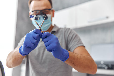 Modern dental surgery, face of a female doctor working on a patient. Dental implantation operation...