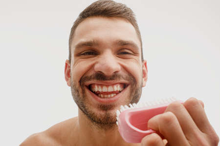 Close up of man open mouth and showing his teethの写真素材