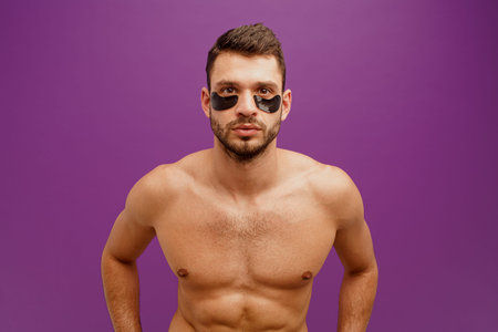 Serious man with under eye patch on faceの写真素材