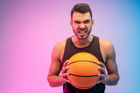 Angry european man hold basketball ball in hands