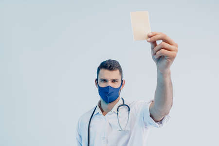 European male doctor show medical plaster in handの写真素材