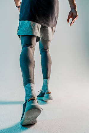 Bottom view of runner sportsman in studioの写真素材