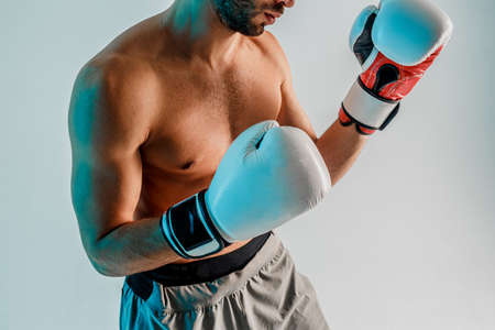 Partial view of young bearded boxer is boxingの写真素材