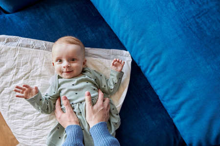 Mother touching with hands newborn baby girlの写真素材