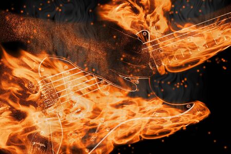 playing a burning string guitar with flames and smokeの写真素材