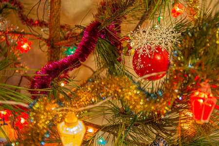 Christmas spruce decorated with tinsel and toysの写真素材