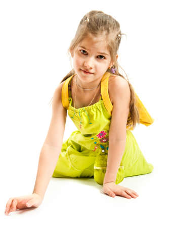 Little girl sitting on the floorの写真素材