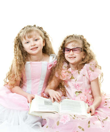 Twin princesses reading a bookの写真素材