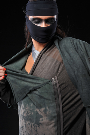 warrior woman wearing masks and different style dressの写真素材