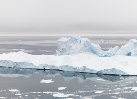 Icebergs on arctic ocean in Ilulissat icefjord, Greenlandの写真素材
