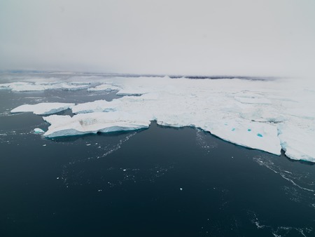 Icebergs on arctic ocean in Ilulissat icefjord, Greenlandの写真素材